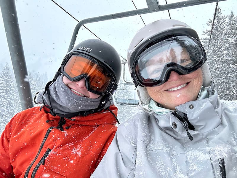 Rebecca and her son on a ski lift